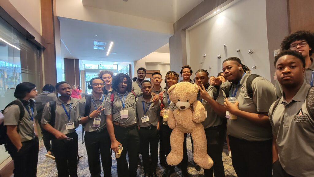 Young Male Leadership Academy (Warren County) with Eddy the Spirit Bear after winning the Spirit Award