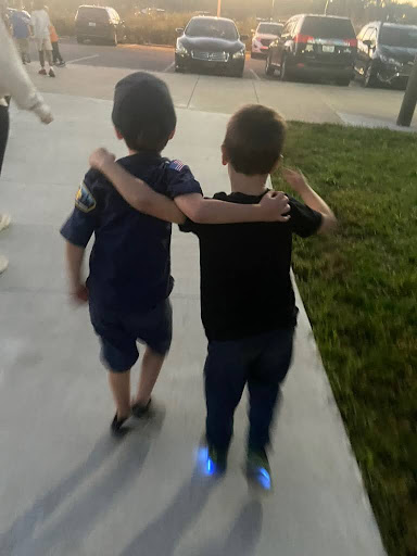 Two students walking independently from teachers