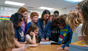 a teacher surrounded by students