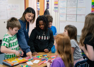 Rachel Maxwell works with students in her classroom.