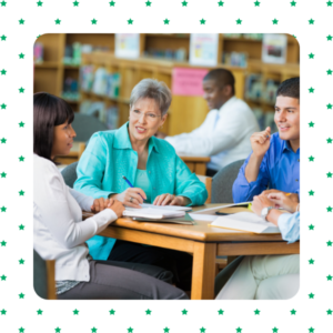 Photo of three teachers sitting at table
