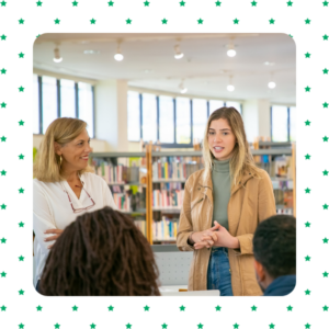 Teacher and student standing in the library