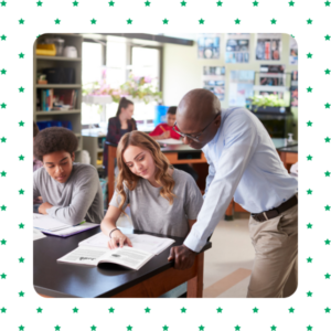 Teacher working with a student sitting in a desk